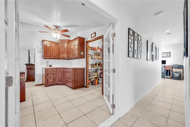 a living room with furniture a dining table and a fireplace