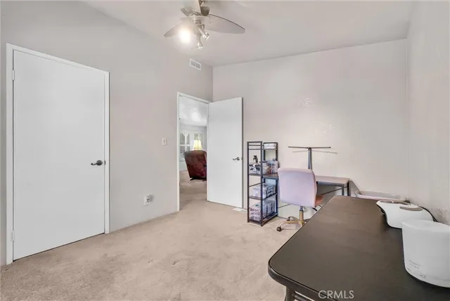 a view of a car parked in front of a building