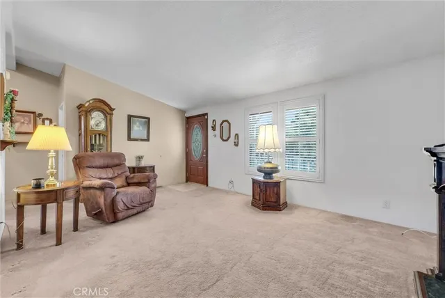 a bed room with furniture and a lamp