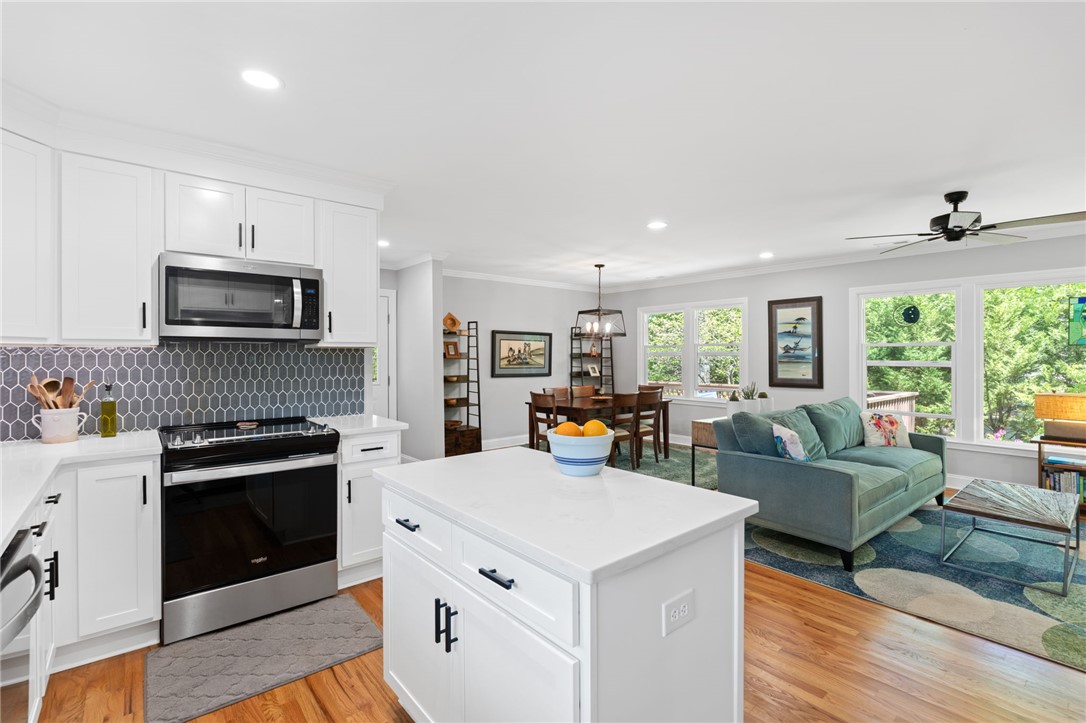 209 Manley Drive Clemson, SC 29631 - Photo 19 of 44 This bright and open-concept home features an inviting kitchen island and abundant natural light.