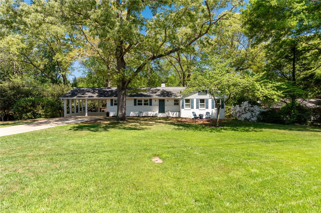 209 Manley Drive Clemson, SC 29631 - Photo 2 of 44 This charming residence offers abundant curb appeal, featuring a spacious lawn and mature trees.