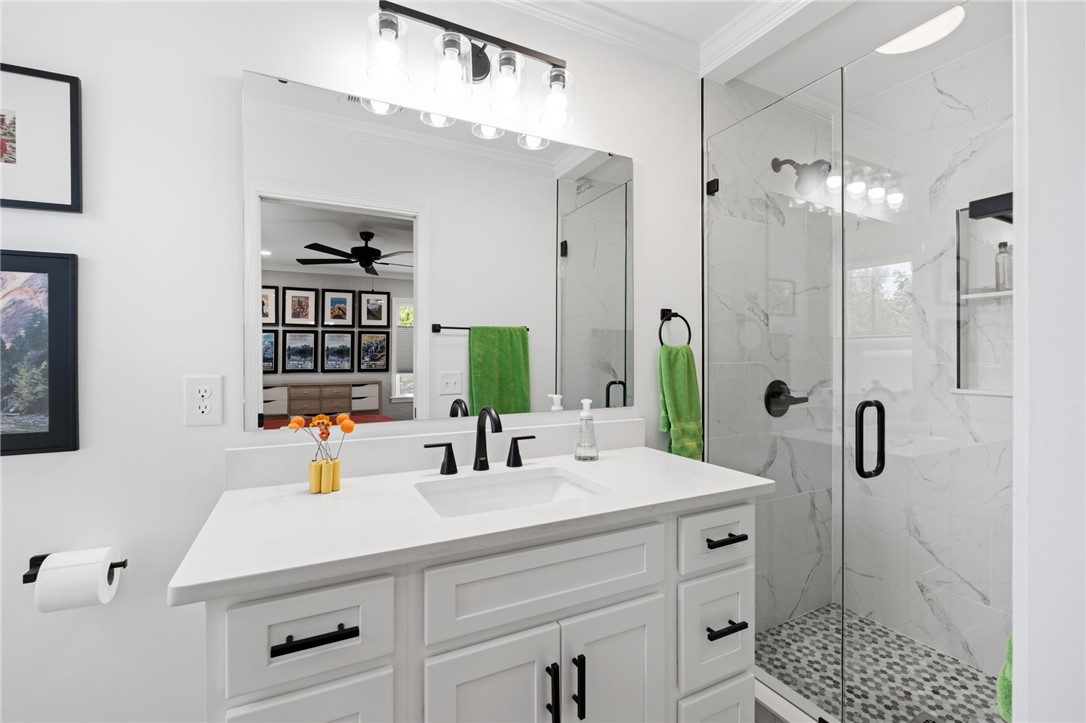 209 Manley Drive Clemson, SC 29631 - Photo 25 of 44 This modern bathroom features a sleek vanity and a spacious, glass-enclosed shower.