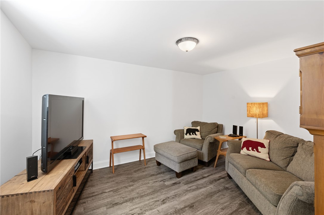 209 Manley Drive Clemson, SC 29631 - Photo 32 of 44 This inviting living space features warm flooring and ample natural light, creating a comfortable atmosphere.