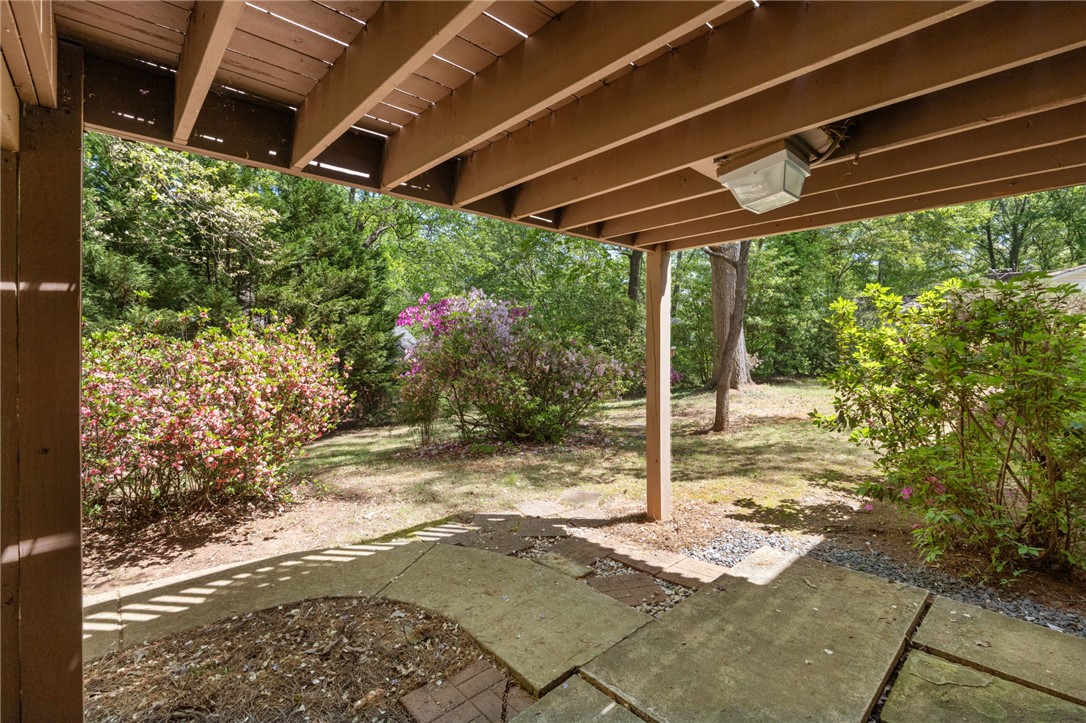 209 Manley Drive Clemson, SC 29631 - Photo 37 of 44 Enjoy the tranquil outdoors from this inviting patio space, surrounded by lush foliage.
