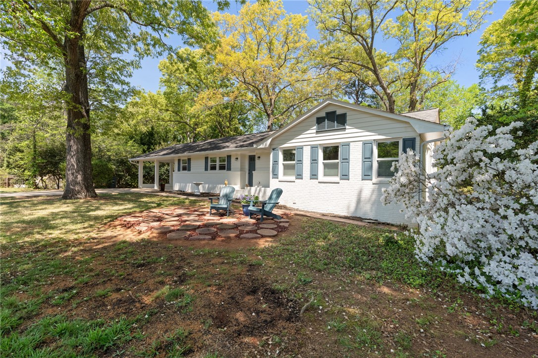 209 Manley Drive Clemson, SC 29631 - Photo 6 of 44 This charming home offers a tranquil setting with ample outdoor space.