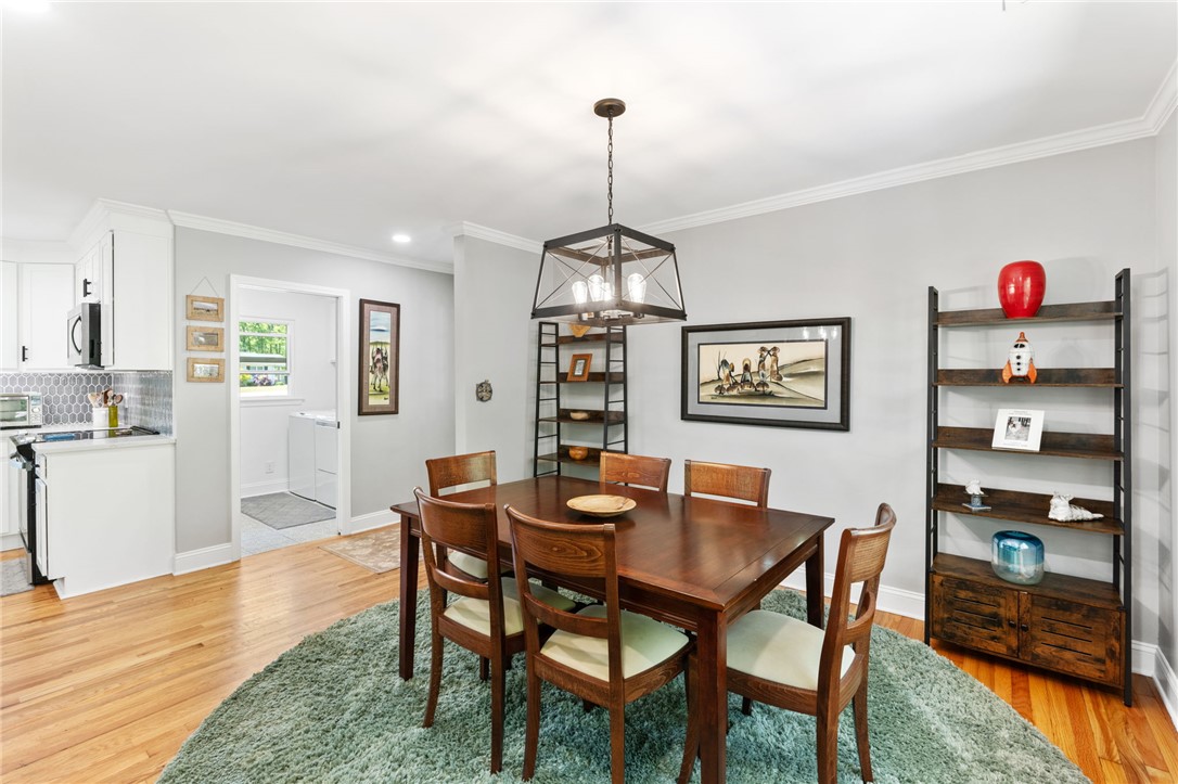 209 Manley Drive Clemson, SC 29631 - Photo 9 of 44 This inviting dining area features elegant hardwood floors and crown molding, perfect for memorable gatherings.