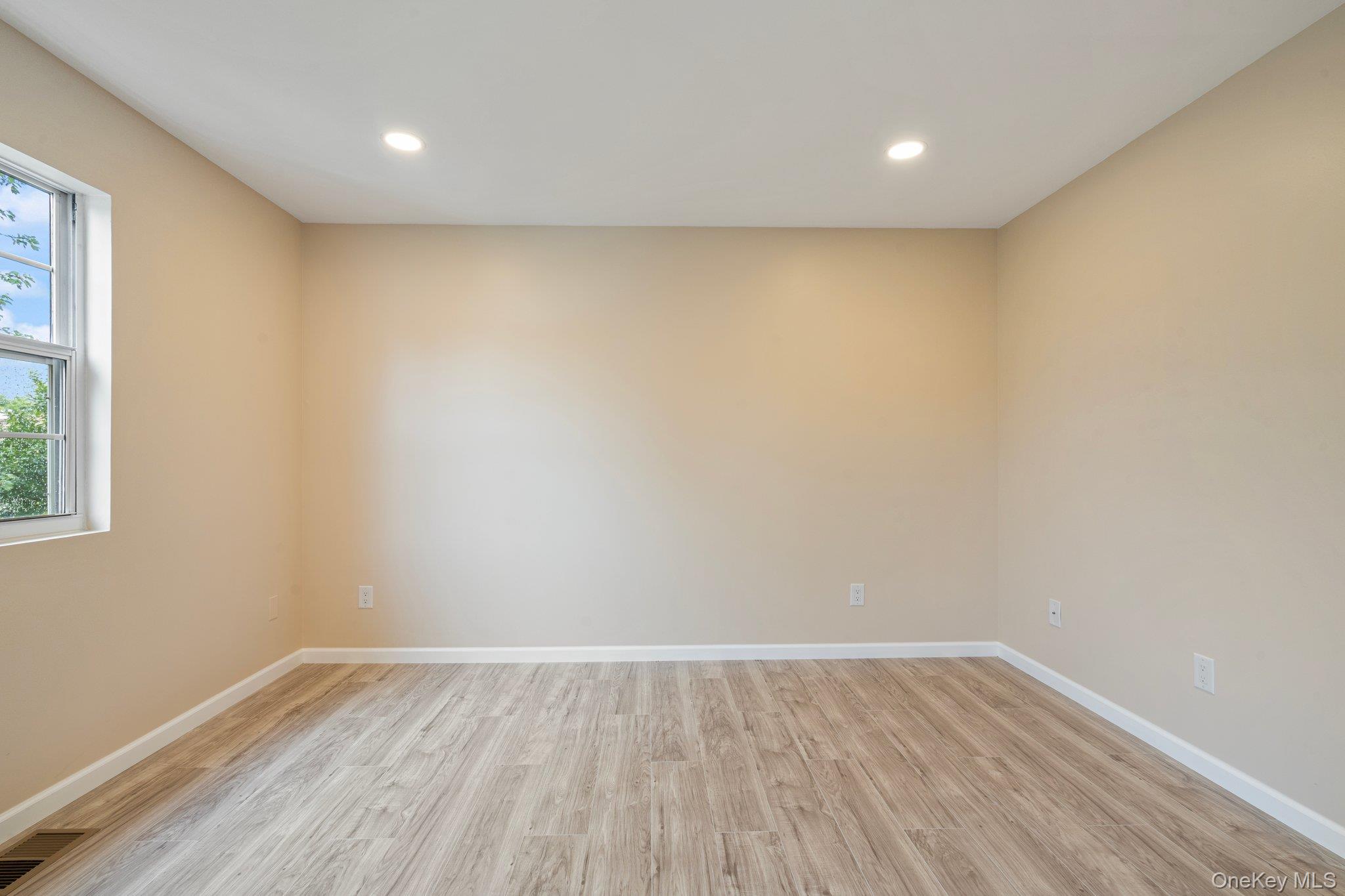 6 Doe Path Coram, NY 11727 - Photo 16 of 48 Spare room featuring light wood-style flooring and recessed lighting