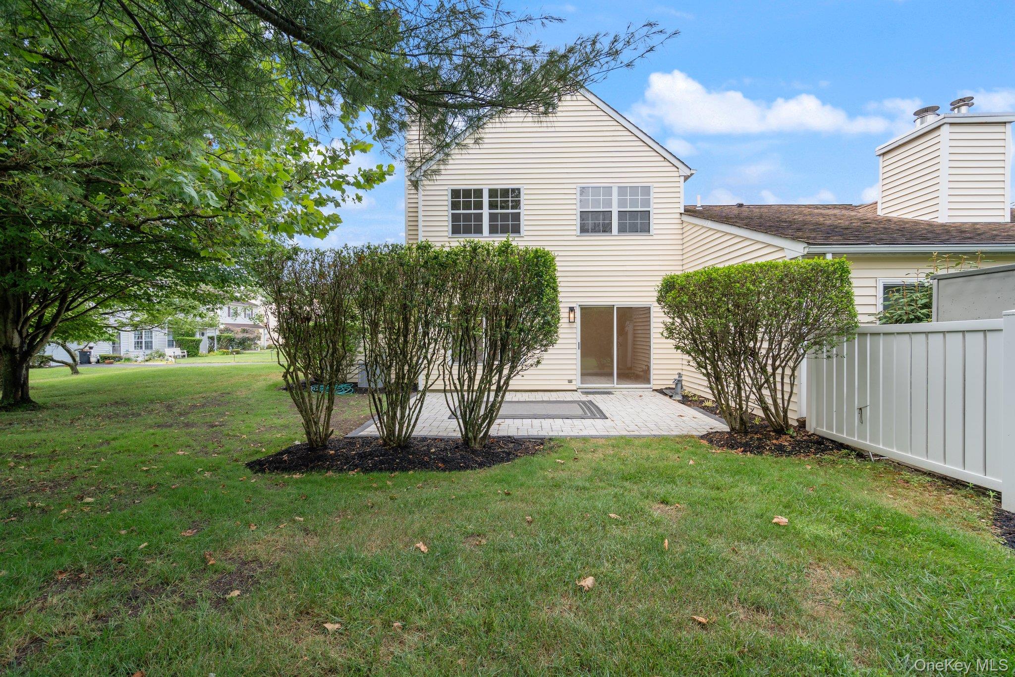 6 Doe Path Coram, NY 11727 - Photo 31 of 48 Back of property with a patio