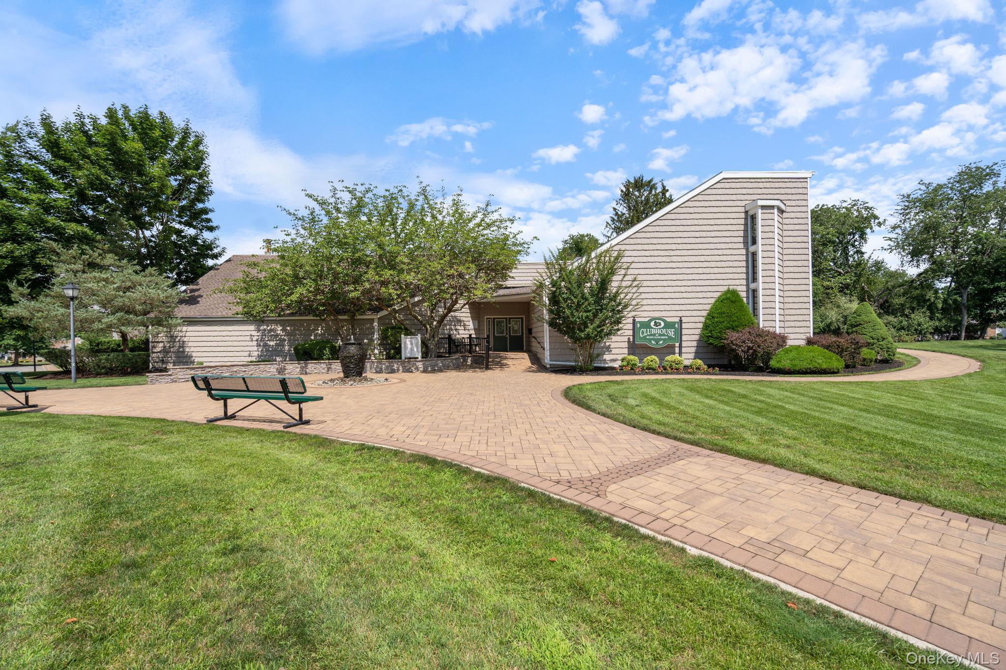 6 Doe Path Coram, NY 11727 - Photo 36 of 48 View of property's community featuring a lawn