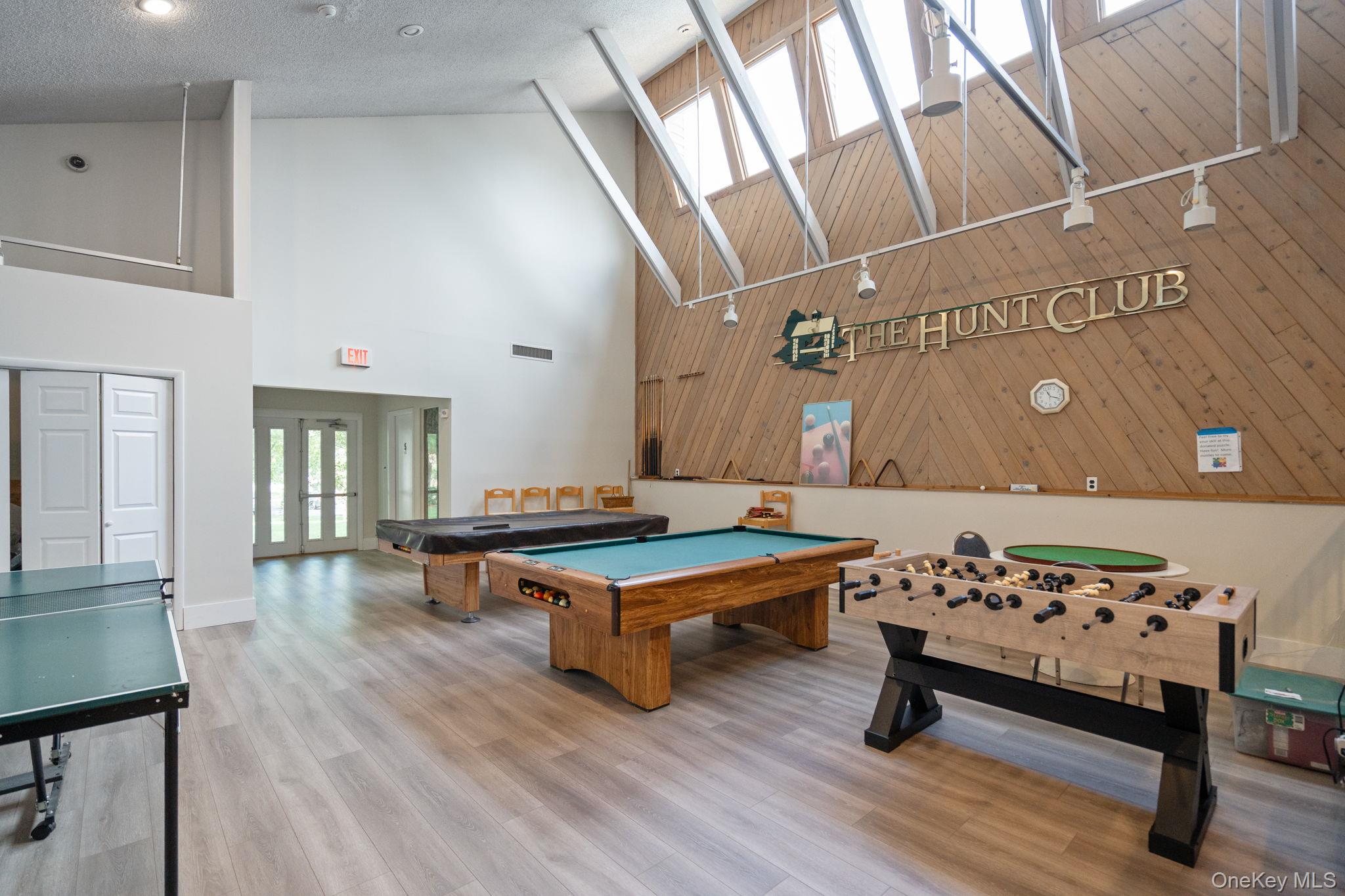 6 Doe Path Coram, NY 11727 - Photo 41 of 48 Game room featuring high vaulted ceiling, a skylight, billiards table, and wood finished floors