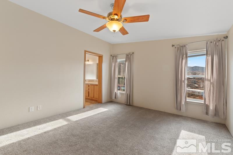 15085 Westwind Circle Reno, NV 89521 - Photo 12 of 28 a view of an empty room with a window