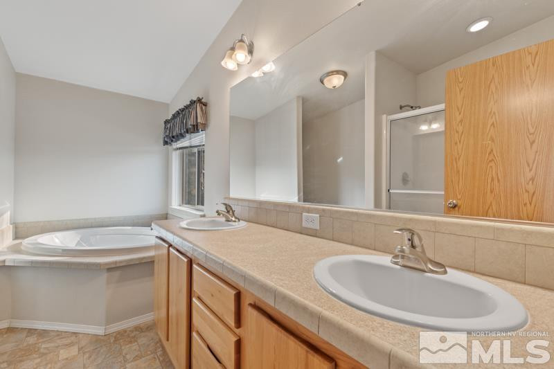 15085 Westwind Circle Reno, NV 89521 - Photo 13 of 28 a bathroom with a sink and a mirror