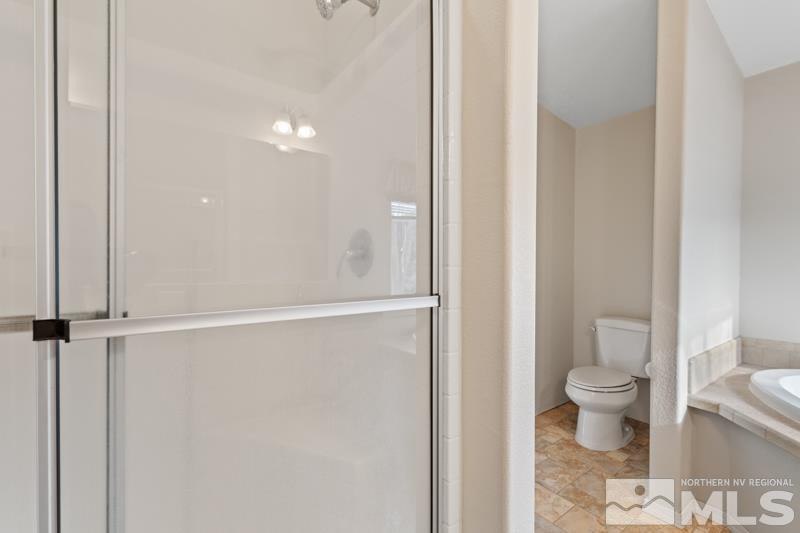 15085 Westwind Circle Reno, NV 89521 - Photo 14 of 28 a bathroom with a toilet and a shower