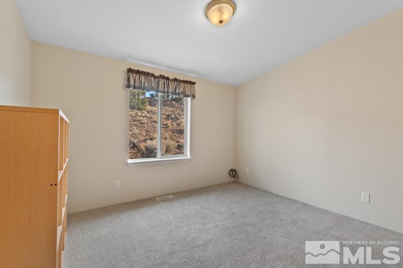 15085 Westwind Circle Reno, NV 89521 - Photo 15 of 28 a view of an empty room with a window