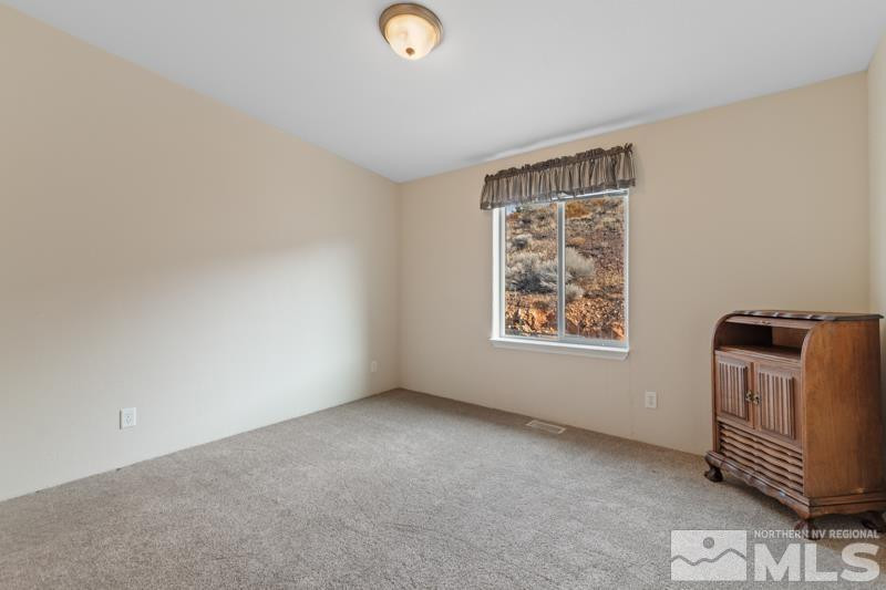 15085 Westwind Circle Reno, NV 89521 - Photo 16 of 28 a view of livingroom with furniture and windows