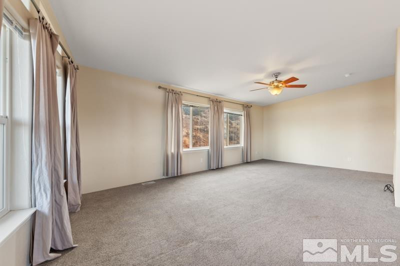 15085 Westwind Circle Reno, NV 89521 - Photo 9 of 28 an empty room with windows