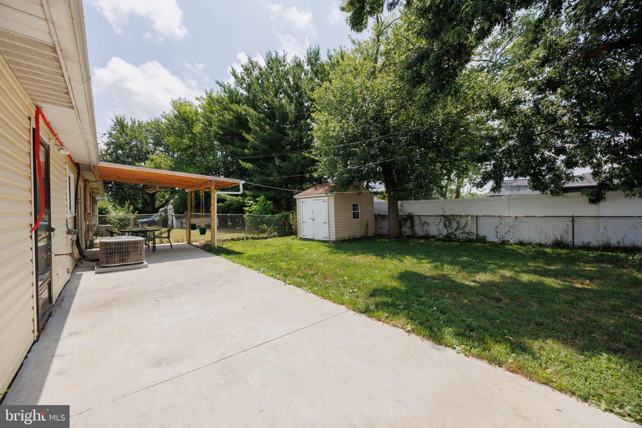 2106 North Rolling Road Windsor Mill, MD 21244 - Photo 19 of 24 Spacious backyard with shaded patio.