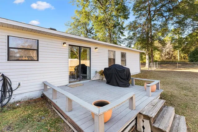 a view of a swimming pool with a bench