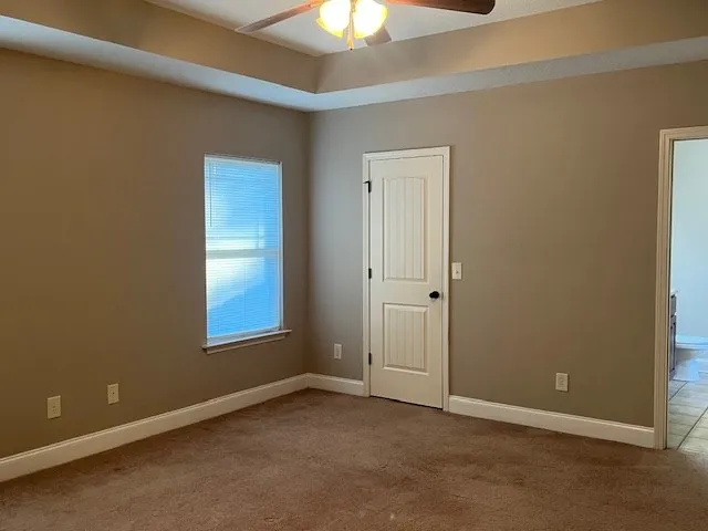 an empty room with closet area