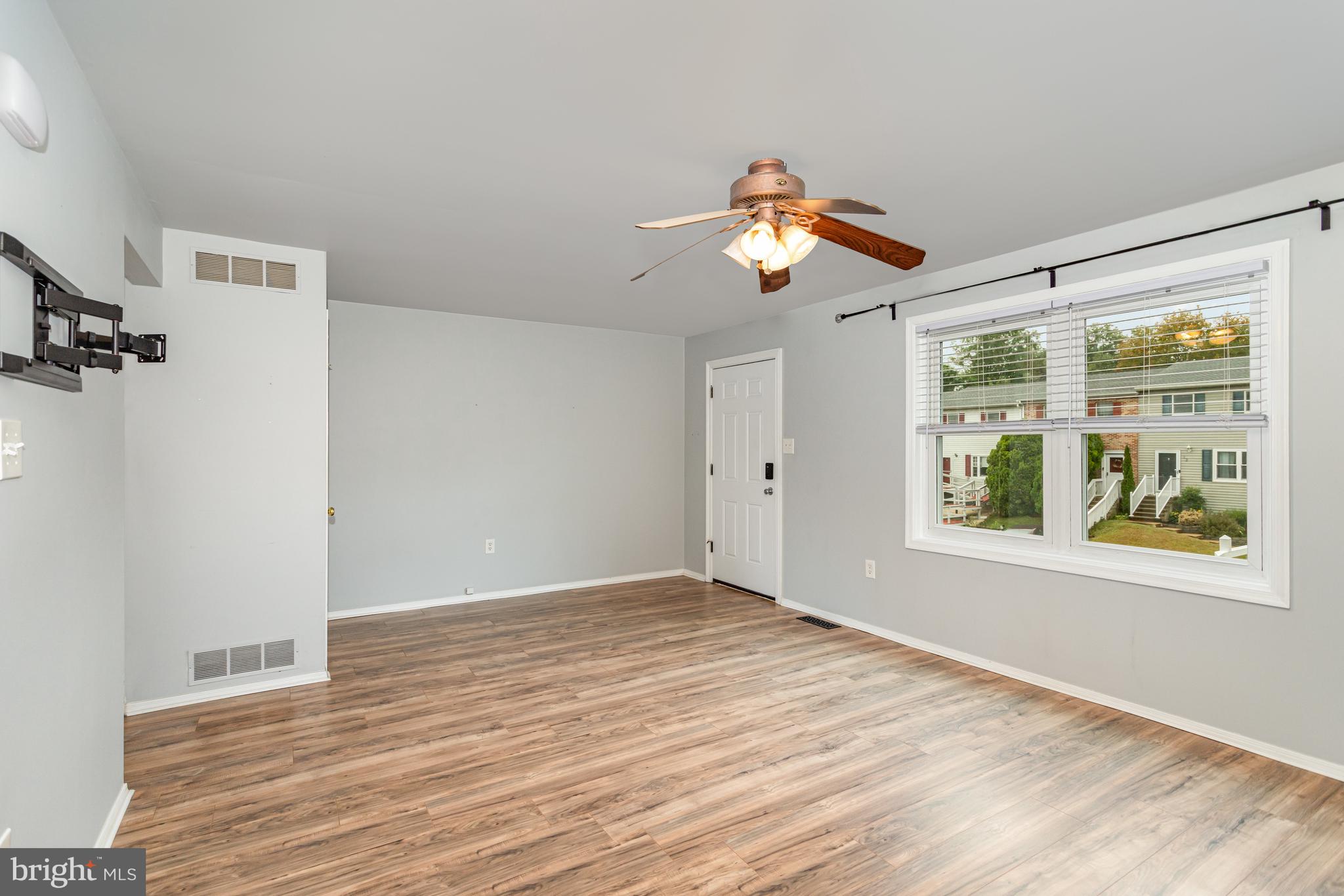 17 Mall Road Etters, PA 17319 - Photo 2 of 25 a view of an empty room with window and wooden floor
