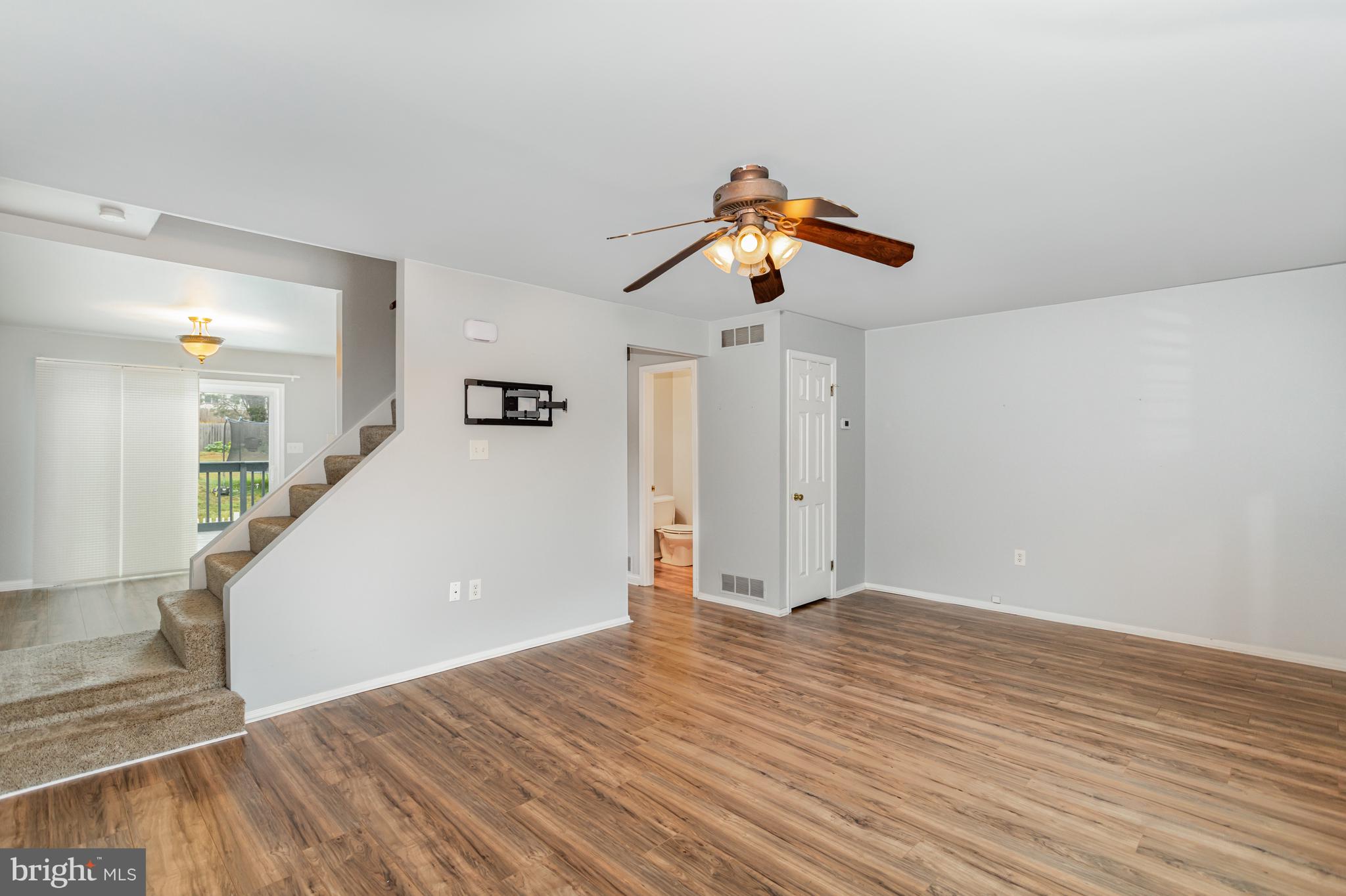 17 Mall Road Etters, PA 17319 - Photo 4 of 25 an empty room with wooden floor and windows