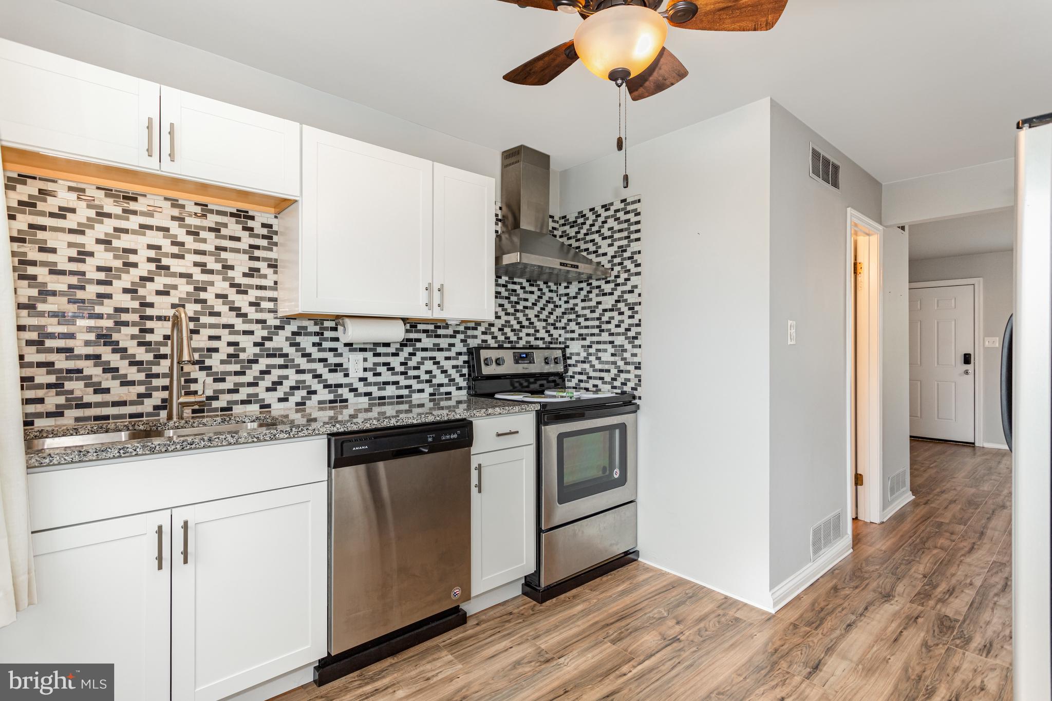 17 Mall Road Etters, PA 17319 - Photo 7 of 25 a kitchen with granite countertop cabinets and a stove top oven
