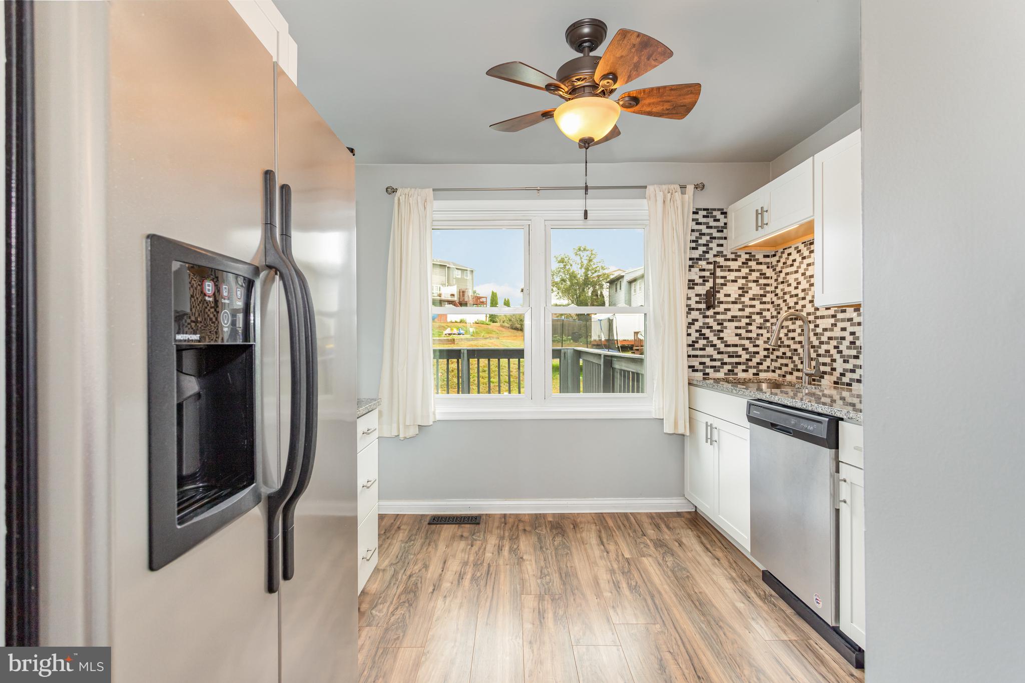 17 Mall Road Etters, PA 17319 - Photo 8 of 25 a view of an empty room with a window and wooden floor