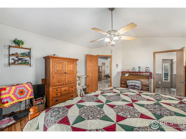 a view of a livingroom with furniture cabinet and window