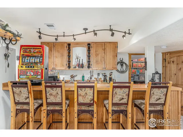 a view of a lake with lawn chairs