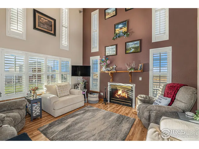 a kitchen with stainless steel appliances granite countertop a stove a sink dishwasher and cabinets with wooden floor