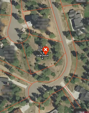 an aerial view of a house with a backyard