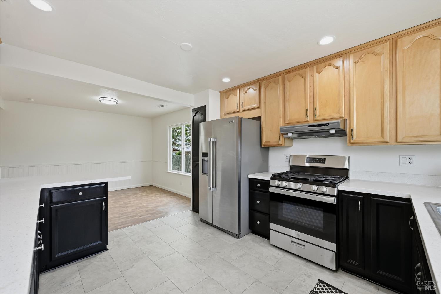 7930 Becky Court Rohnert Park, CA 94928 - Photo 11 of 33 a kitchen with stainless steel appliances a refrigerator and a stove top oven