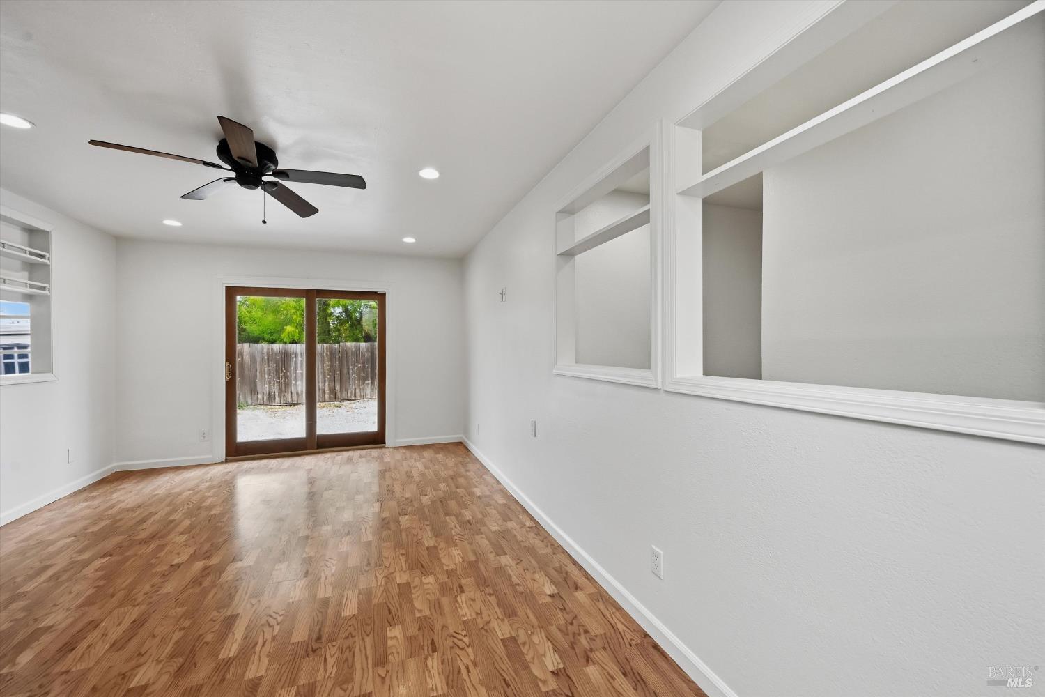 7930 Becky Court Rohnert Park, CA 94928 - Photo 15 of 33 wooden floor in an empty room with a window