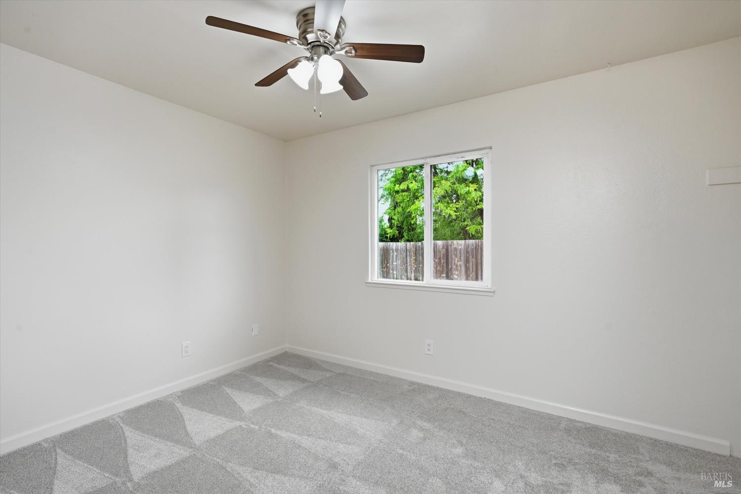 7930 Becky Court Rohnert Park, CA 94928 - Photo 18 of 33 an empty room with a window and a fan