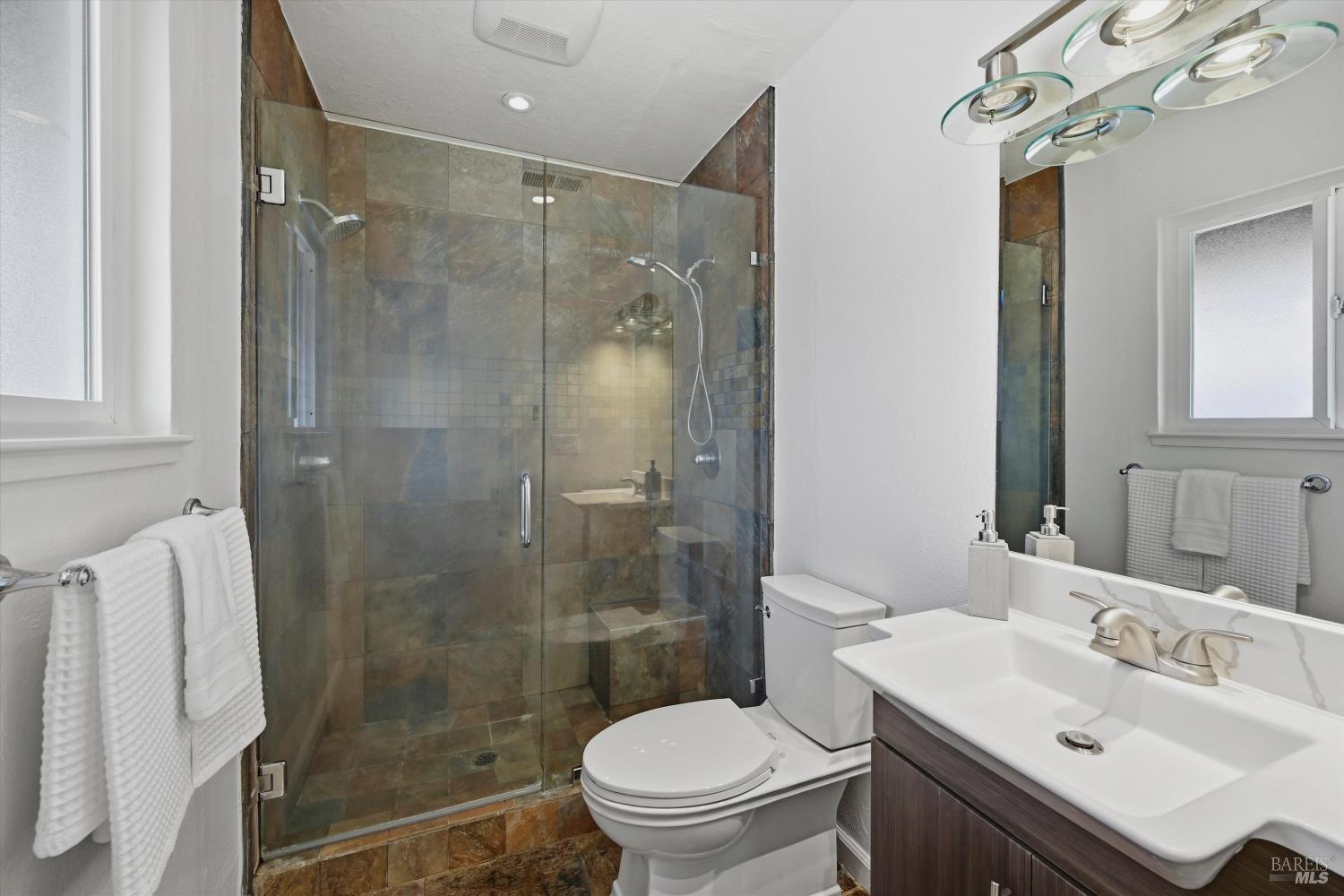 7930 Becky Court Rohnert Park, CA 94928 - Photo 22 of 33 a bathroom with a sink toilet and shower