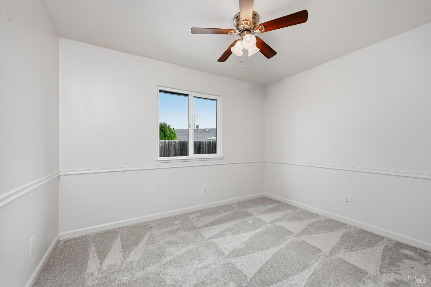 7930 Becky Court Rohnert Park, CA 94928 - Photo 24 of 33 an empty room with a window and ceiling fan
