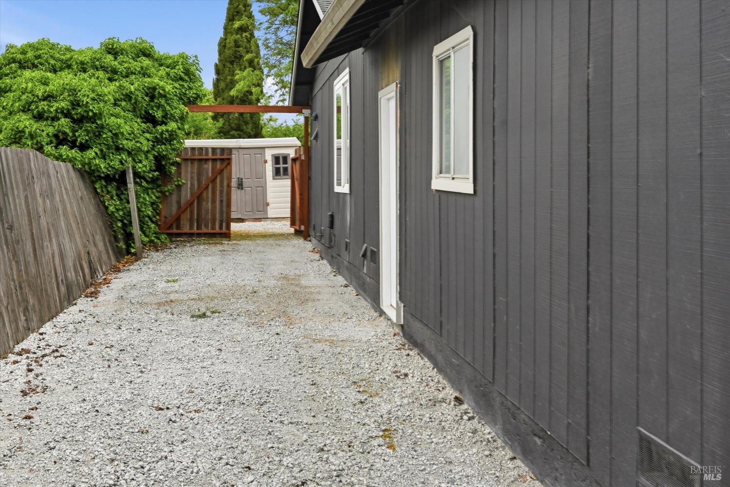 7930 Becky Court Rohnert Park, CA 94928 - Photo 30 of 33 a view of a backyard with wooden fence