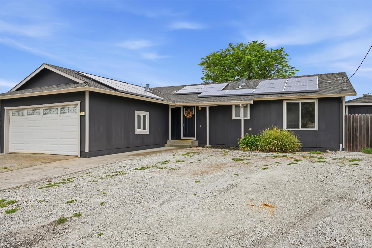 7930 Becky Court Rohnert Park, CA 94928 - Photo 3 of 33 a front view of a house with a garden