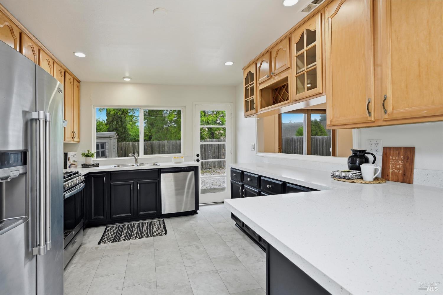 7930 Becky Court Rohnert Park, CA 94928 - Photo 4 of 33 a kitchen with a sink a counter top space and stainless steel appliances