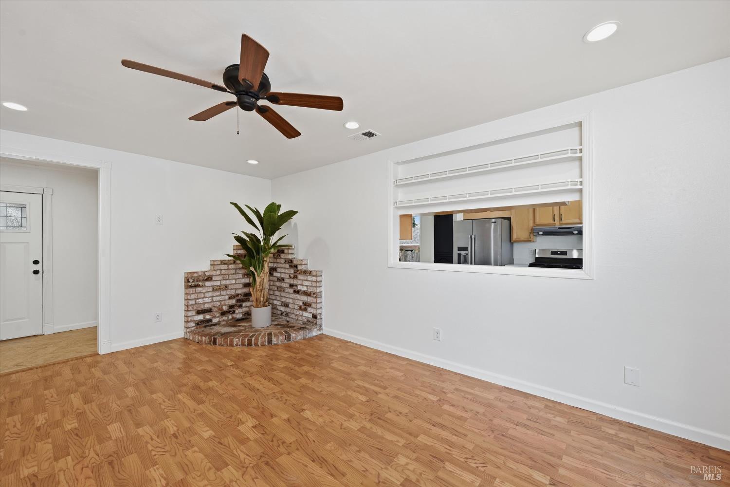 7930 Becky Court Rohnert Park, CA 94928 - Photo 5 of 33 a view of a livingroom with wooden floor and a ceiling fan