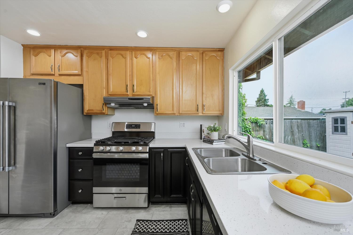 7930 Becky Court Rohnert Park, CA 94928 - Photo 10 of 33 a kitchen with a stove a sink and a refrigerator