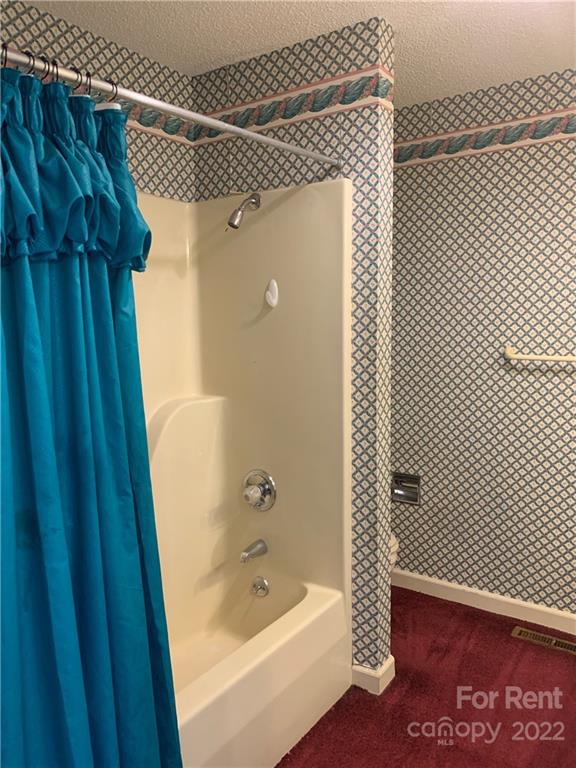 954 Old Charlotte Road Southwest Concord, NC 28027 - Photo 11 of 15 a bathroom with a shower and a tub