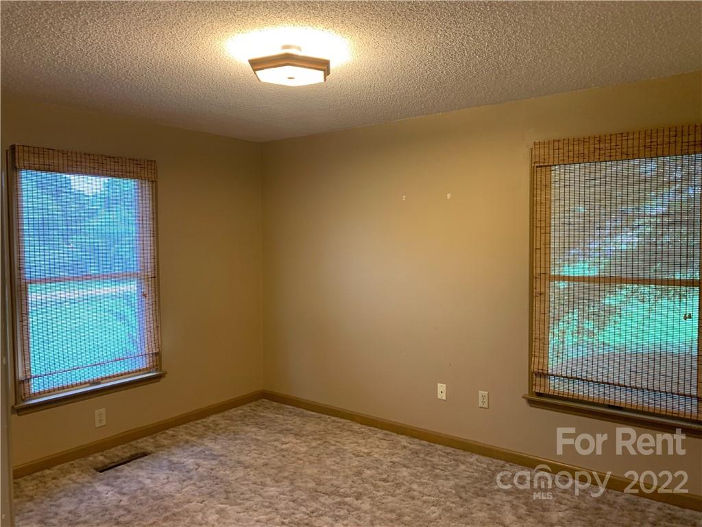 954 Old Charlotte Road Southwest Concord, NC 28027 - Photo 12 of 15 an empty room with windows