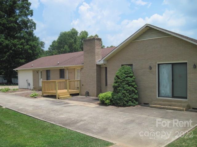 954 Old Charlotte Road Southwest Concord, NC 28027 - Photo 15 of 15 a front view of a house with garden