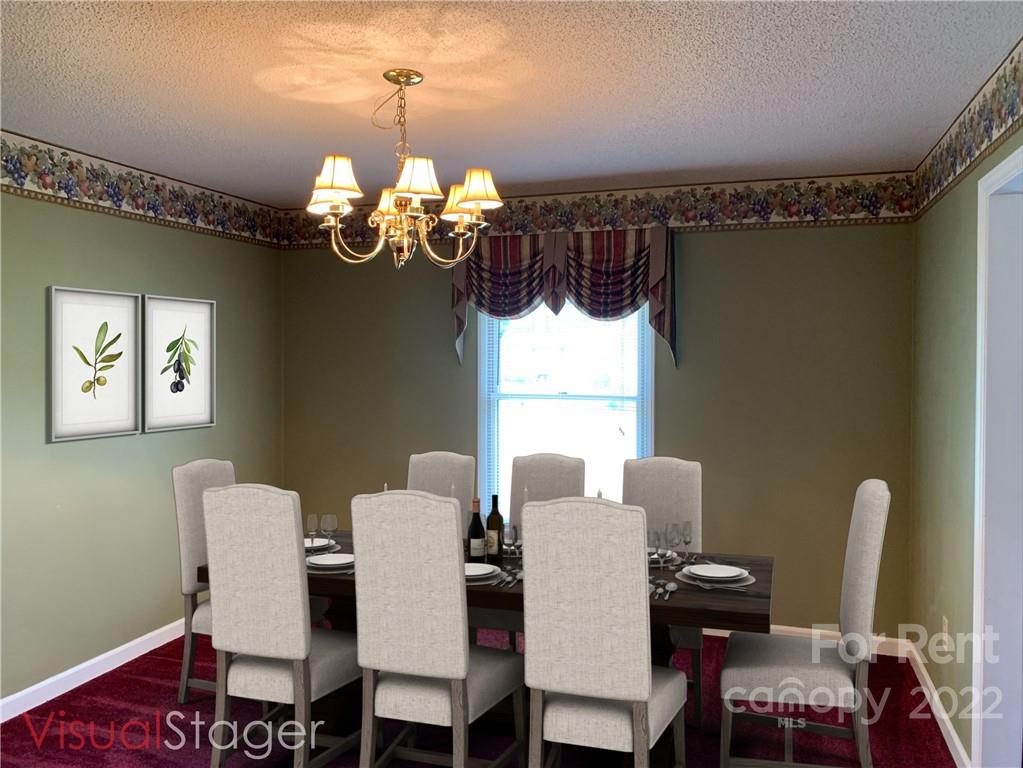 954 Old Charlotte Road Southwest Concord, NC 28027 - Photo 4 of 15 a view of a dining room with furniture a chandelier and wooden floor