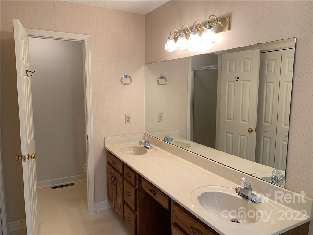 954 Old Charlotte Road Southwest Concord, NC 28027 - Photo 9 of 15 a bathroom with a sink and a mirror