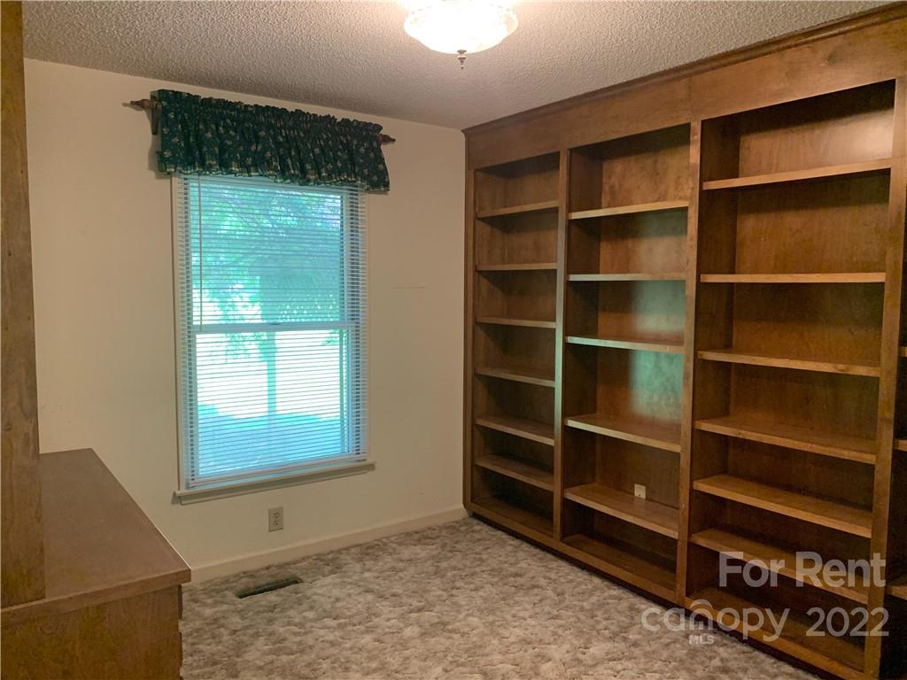 954 Old Charlotte Road Southwest Concord, NC 28027 - Photo 10 of 15 a view of an empty room with a window