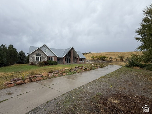 4458 East Glencoe Road Preston, ID 83263 - Photo 52 of 52 Stone and brick exterior with a metal roof