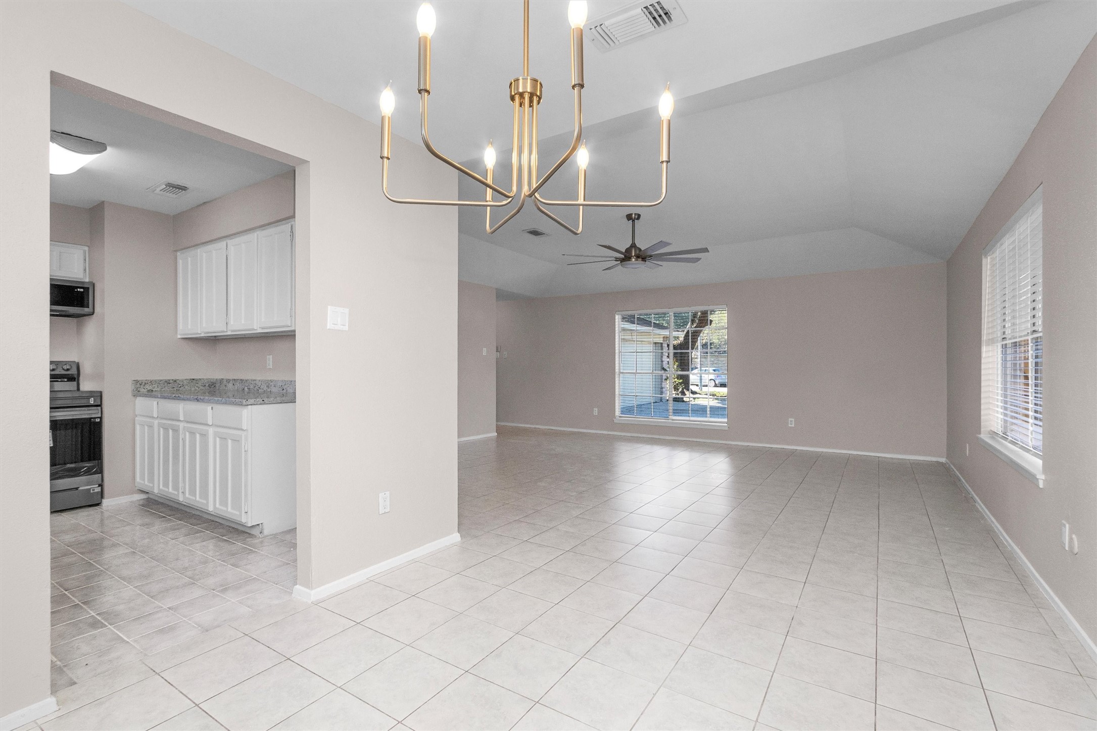 21030 Rivershadows Lane Spring, TX 77388 - Photo 11 of 38 a view of a kitchen with a sink and a window