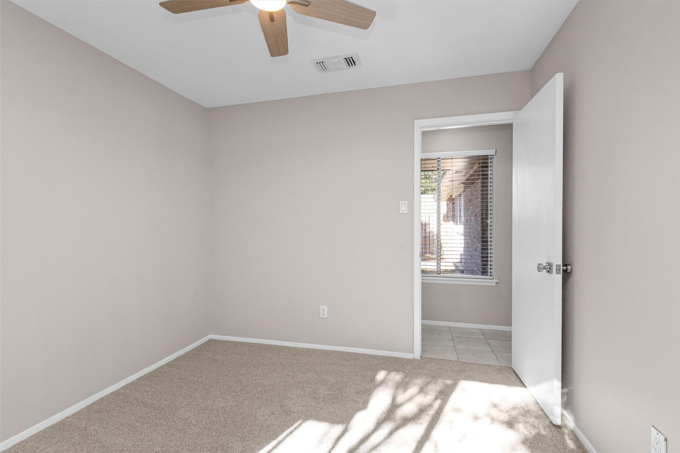 21030 Rivershadows Lane Spring, TX 77388 - Photo 18 of 38 an empty room with windows and closet